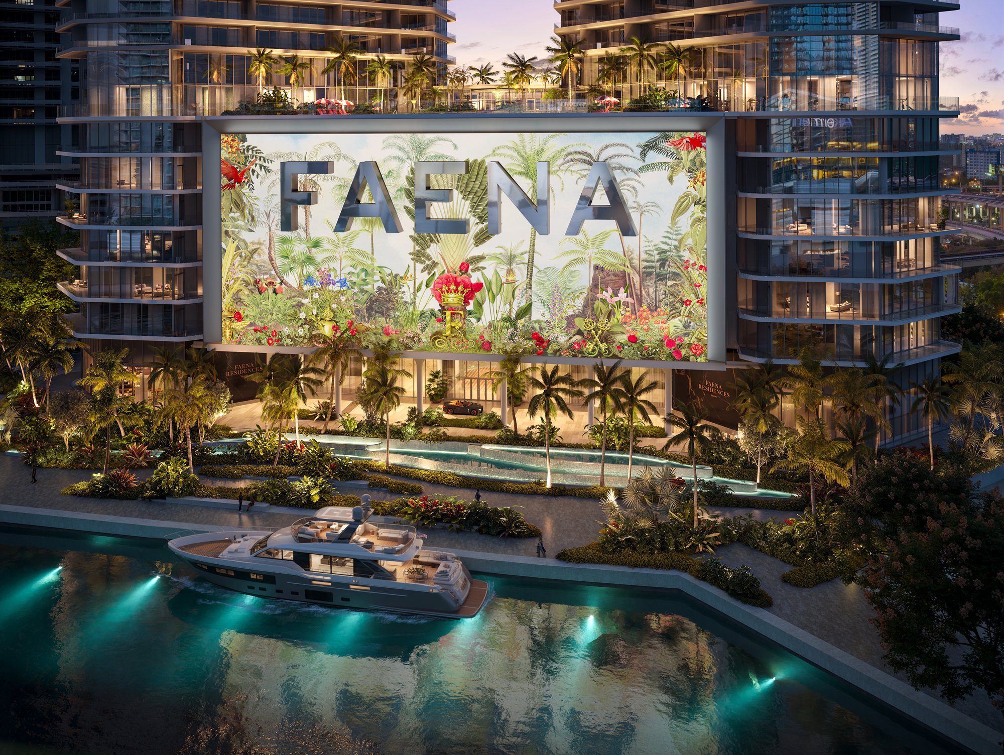 Aerial of the Faena Residences riverfront with the FAENA botanical signage and a yacht on the Miami River